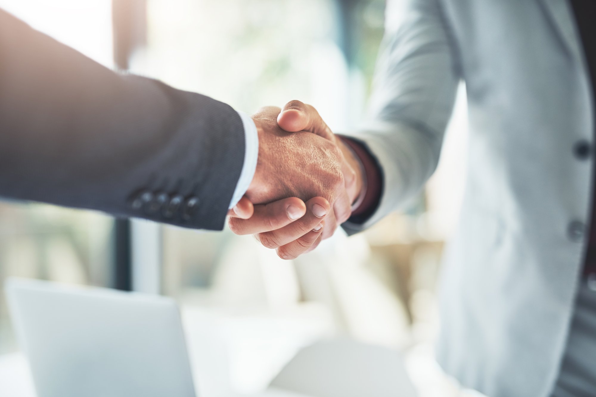 two businesspeople shaking hands